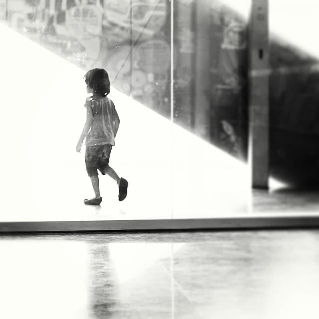 Were you curious as a kid? Did you wander off at stations and bus stands when elders were busy with luggage and porters? Did windows, tall buildings, double decker buses, trains and platforms fascinated you? How did you push and test your boundaries? What were you and were you not allowed to do? Do you remember yourself when you see kids doing things other than being glued to mobile phones or tablets. On a different note, last weekend I learnt that shooting from behind glass gives amazing textures from the reflections. Especially in the dark areas when the contrast and shadows are bumped up.