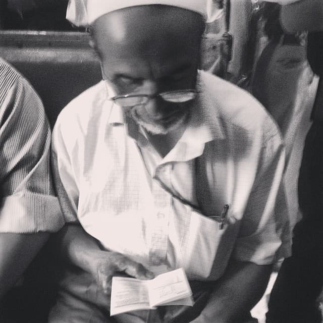 This uncle was catching up on his new smartphone manual. Page by page.